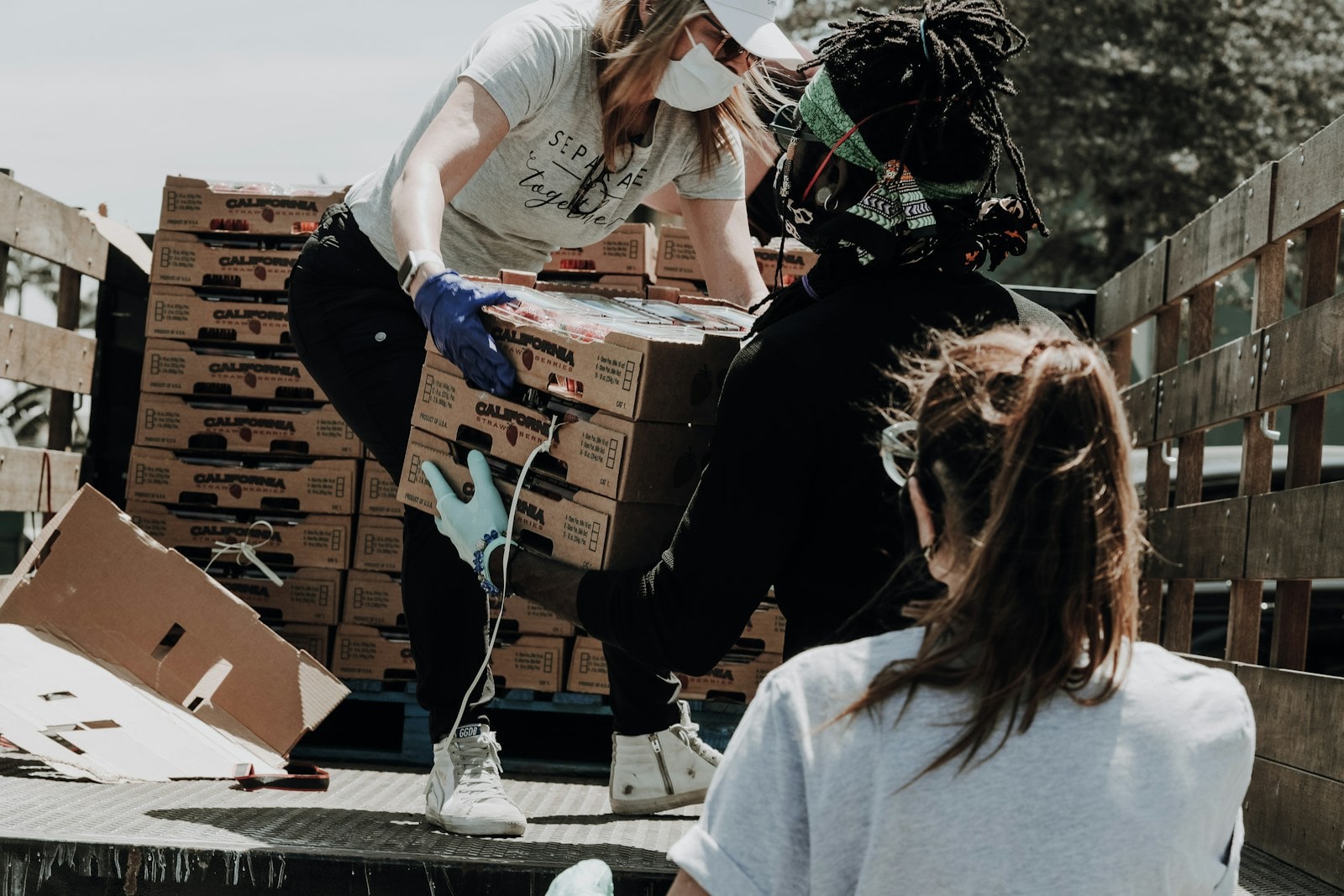 Volunteers packing food donations for a community charity distribution